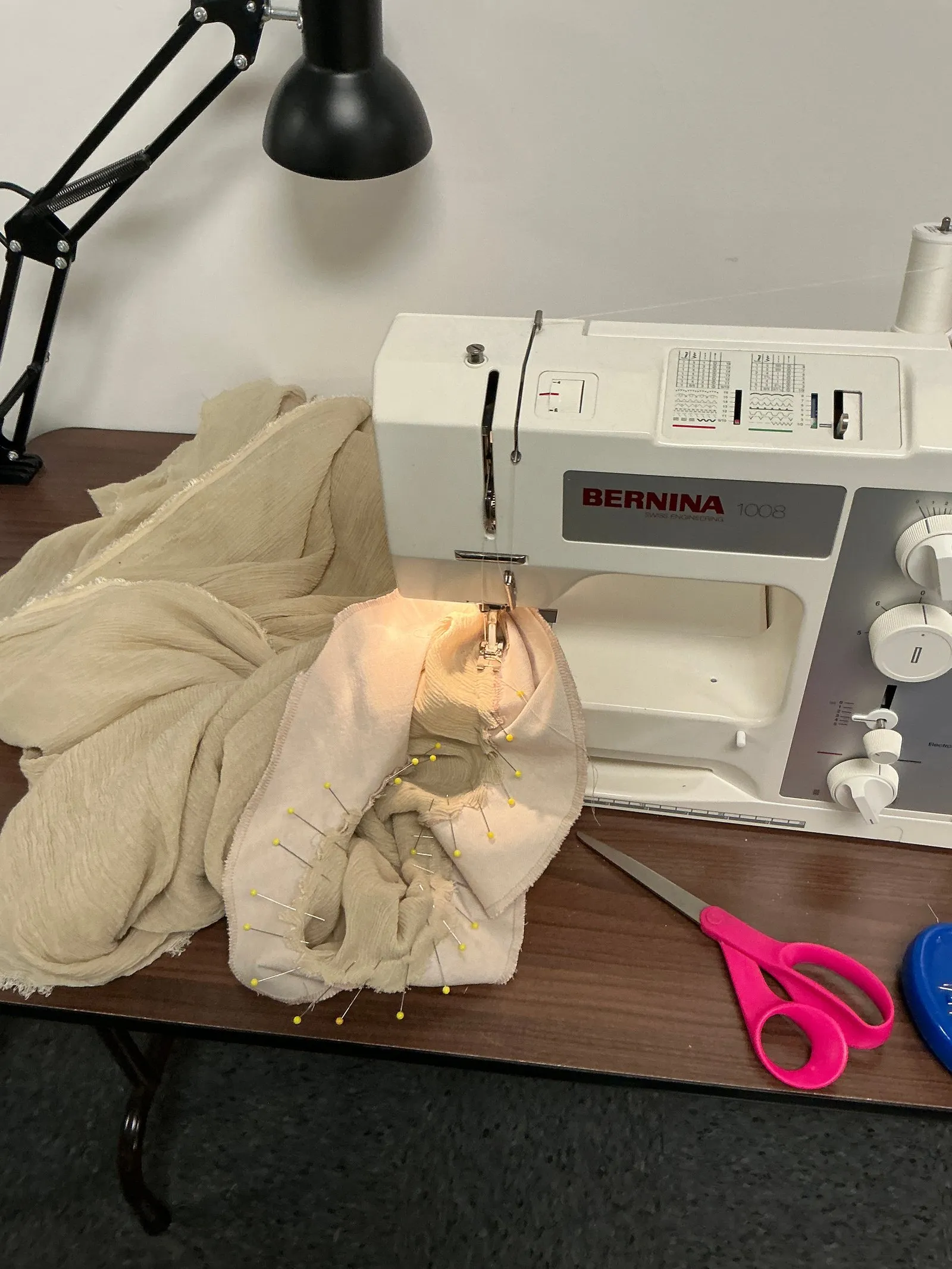 Sewing a chorus costume for Antigone.