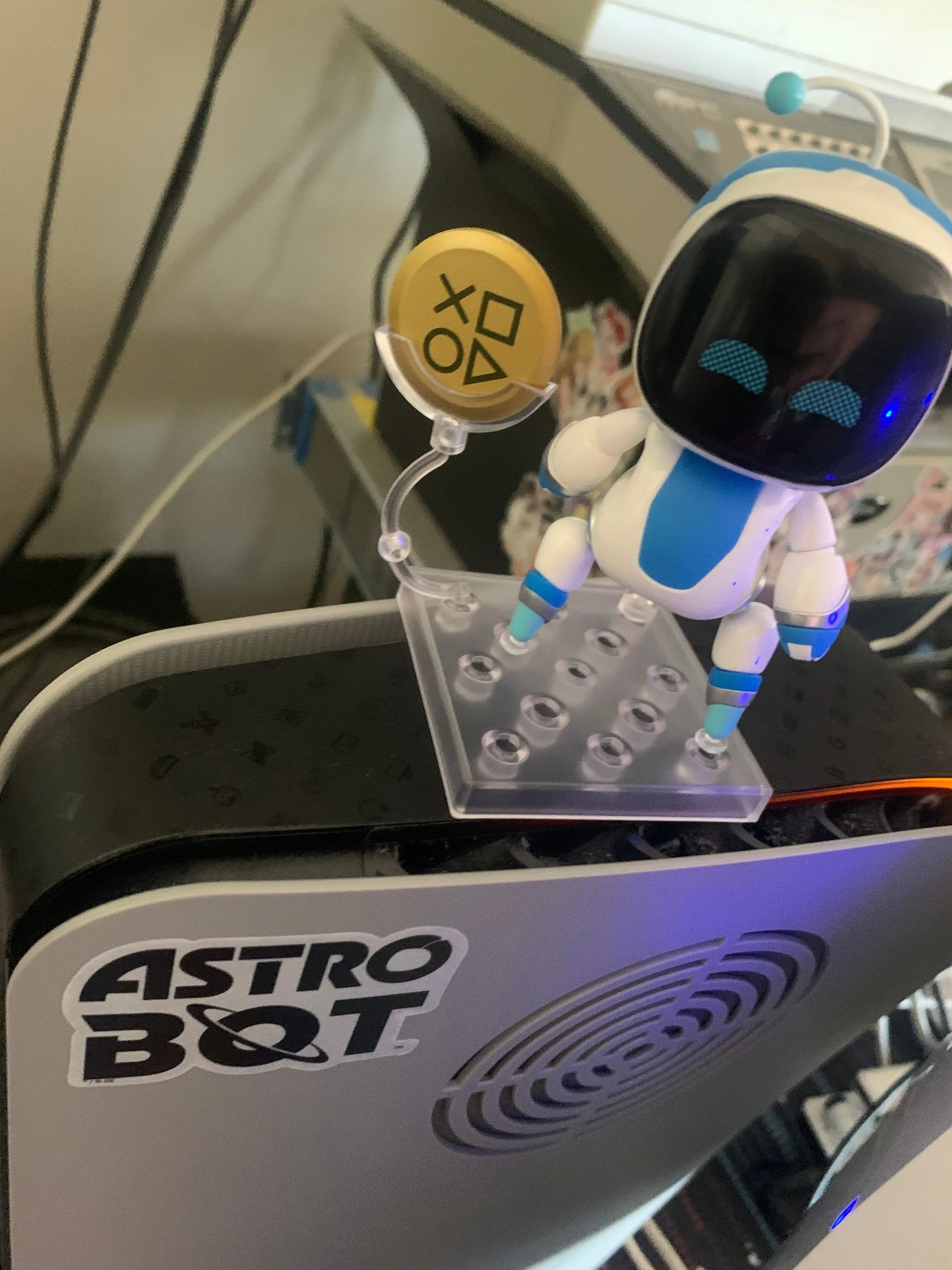 Astro Bot figure on top of my PS5.