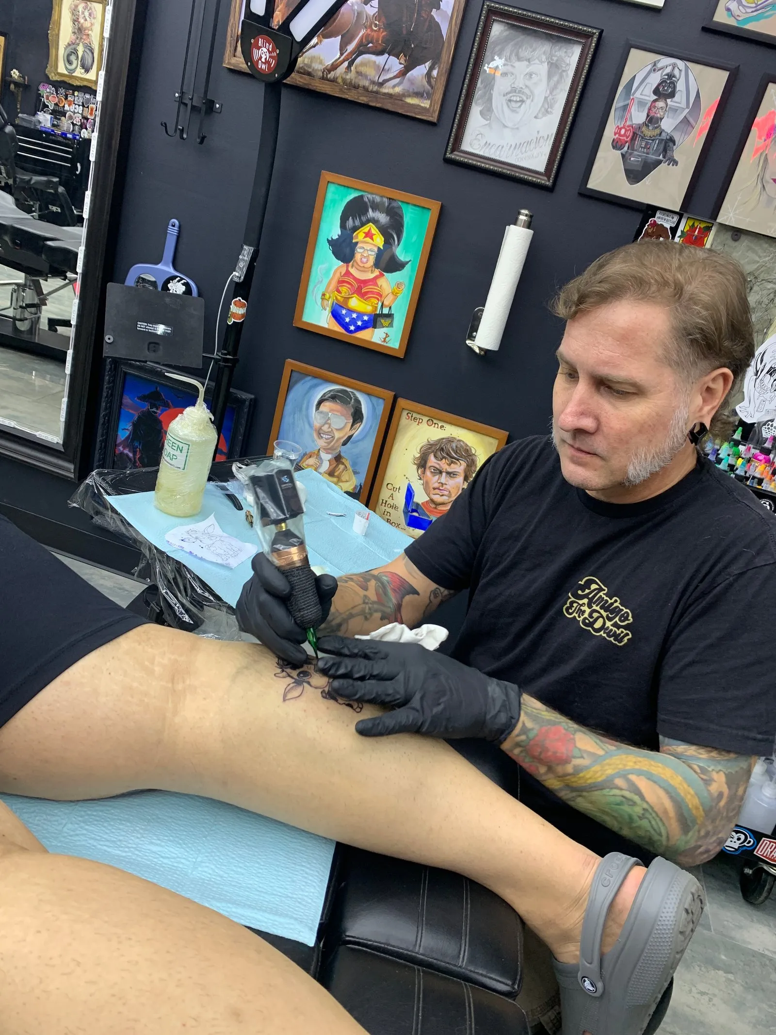A local tattoo artist drawing a calf on my friend's calf