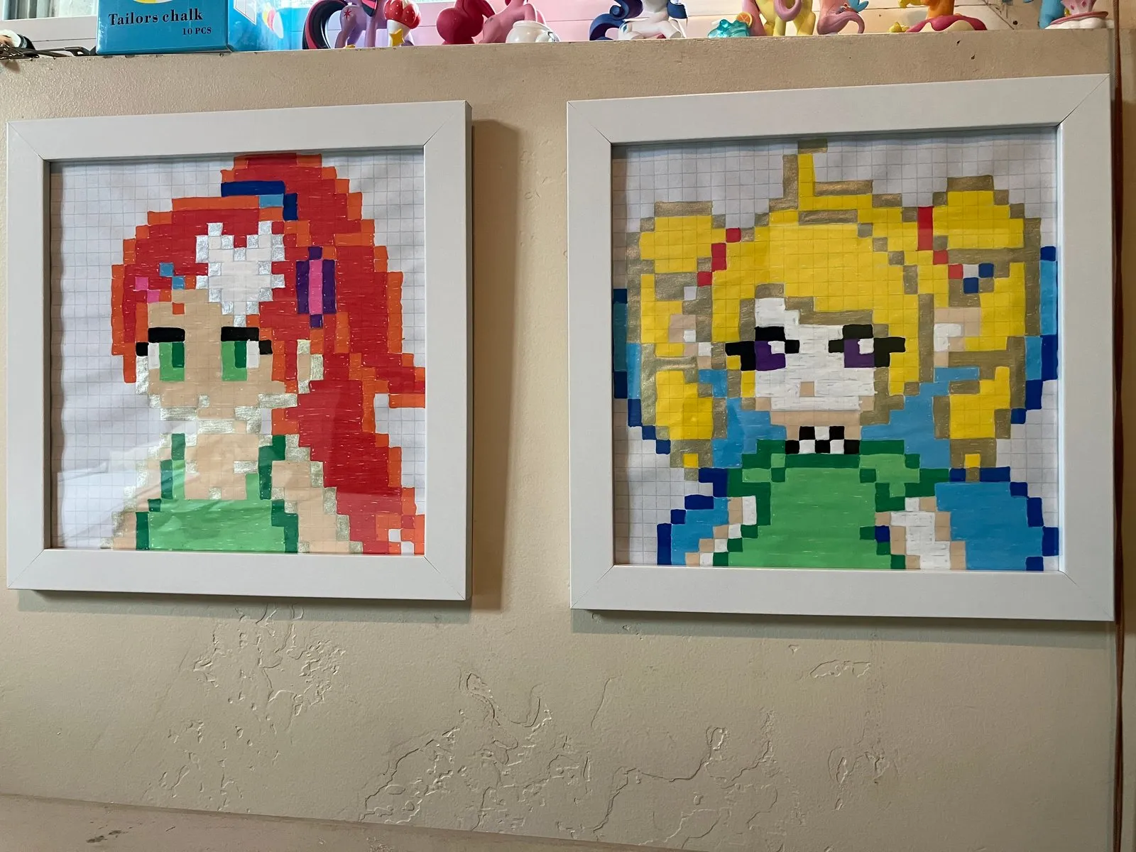 Pixel grid art of Daisy and Annie, drawn with posca paint pens.