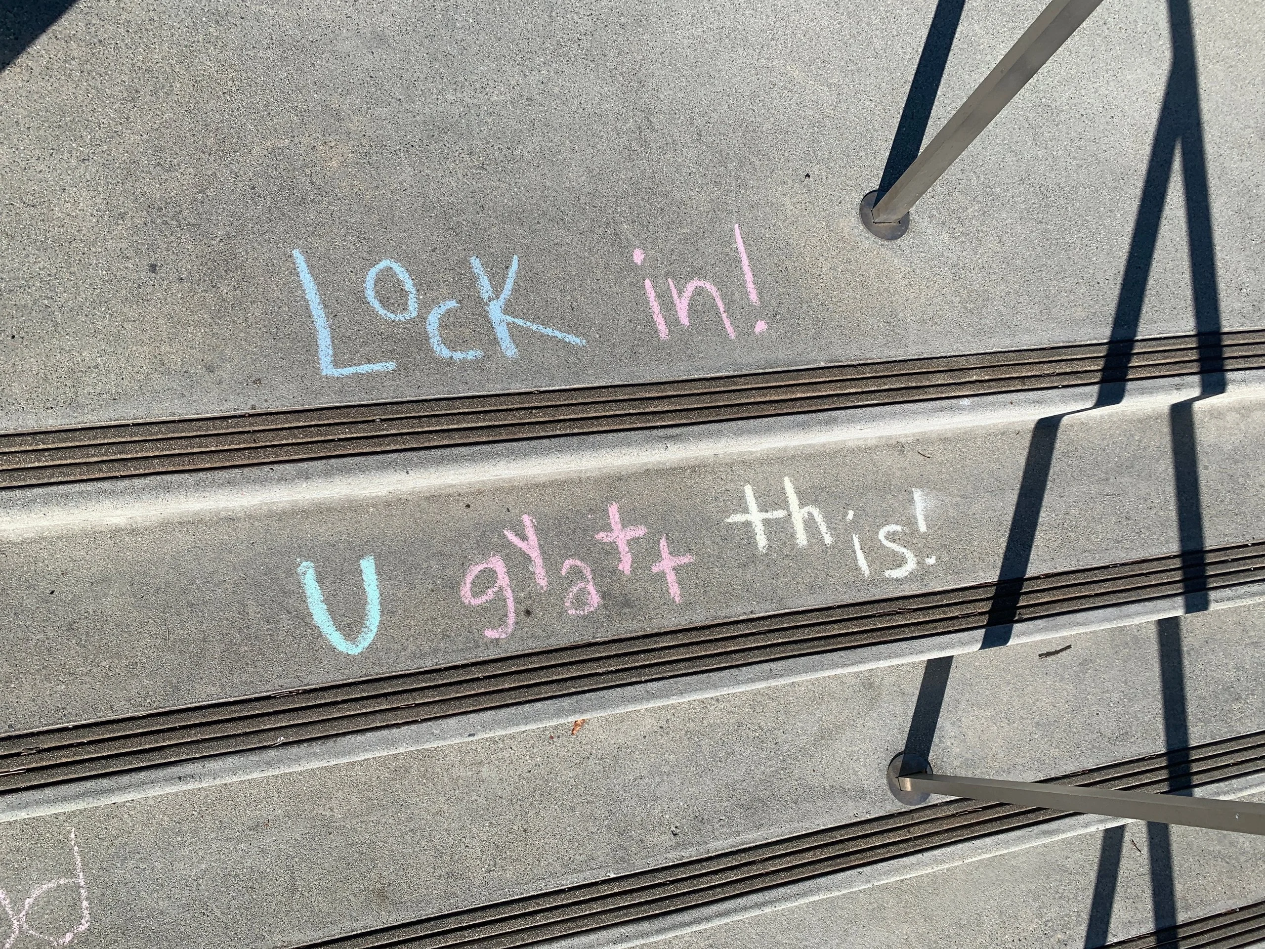 Sidewalk art encouraging students: "Lock in! U gyatt this!"