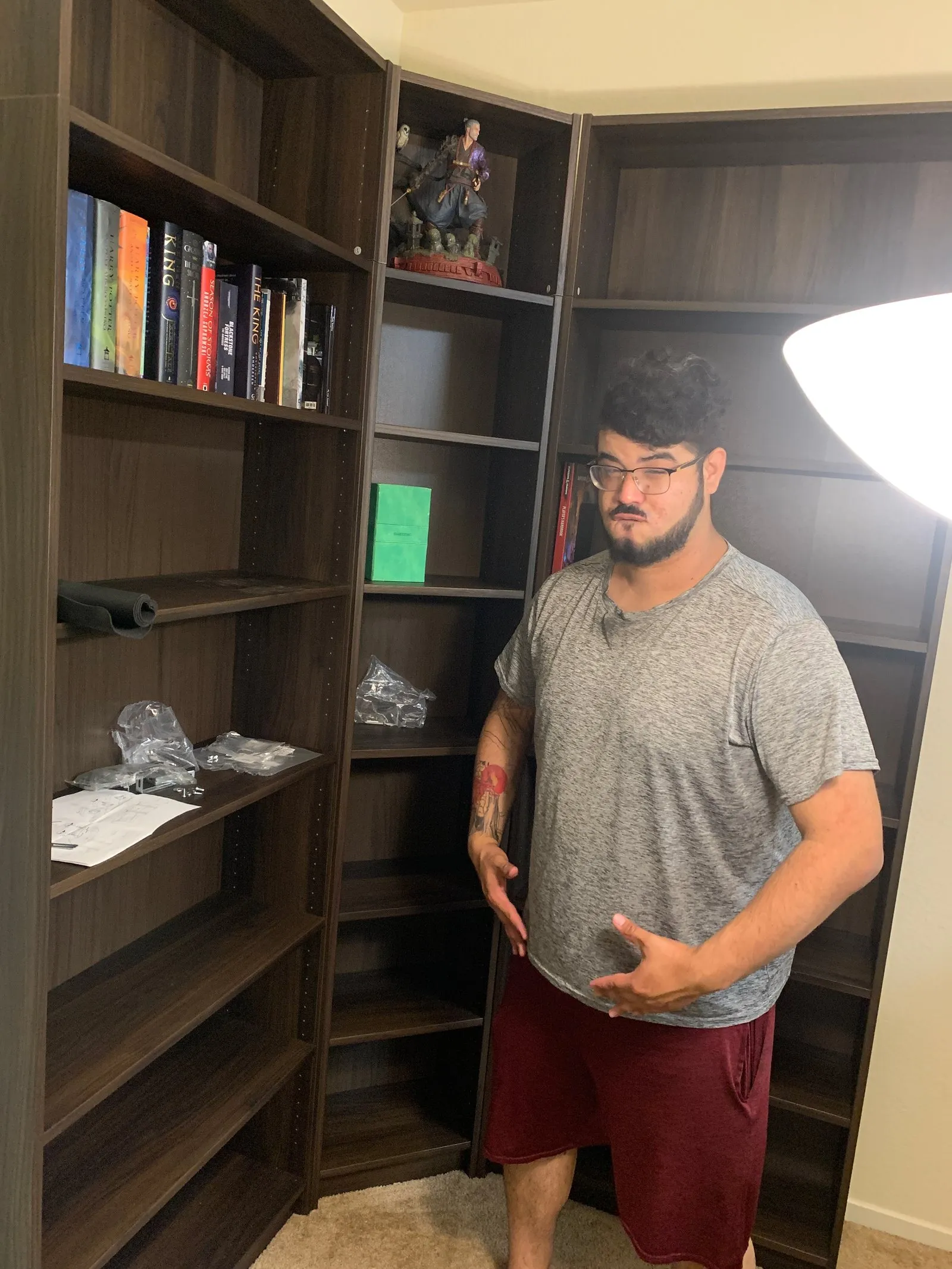 Helping Rudy assemble a bookcase.