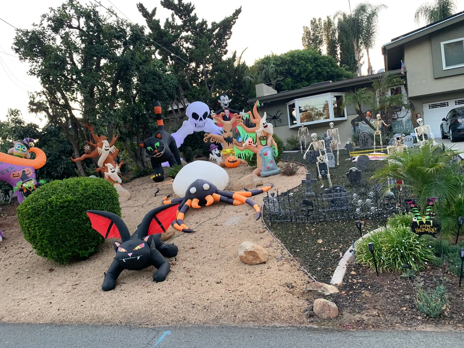 A photo of a neighbor's house decorated for Halloween