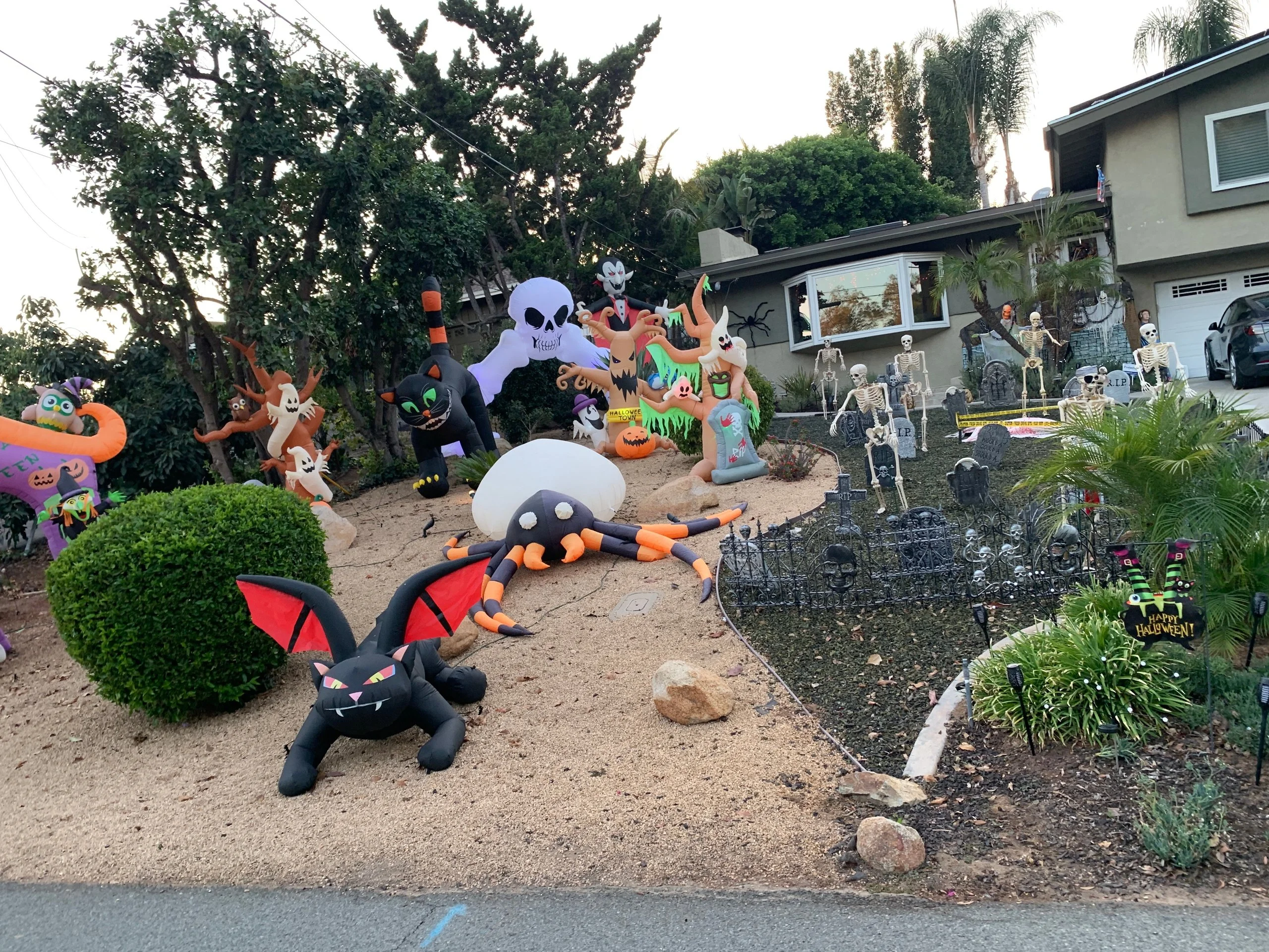 A photo of a neighbor's house decorated for Halloween
