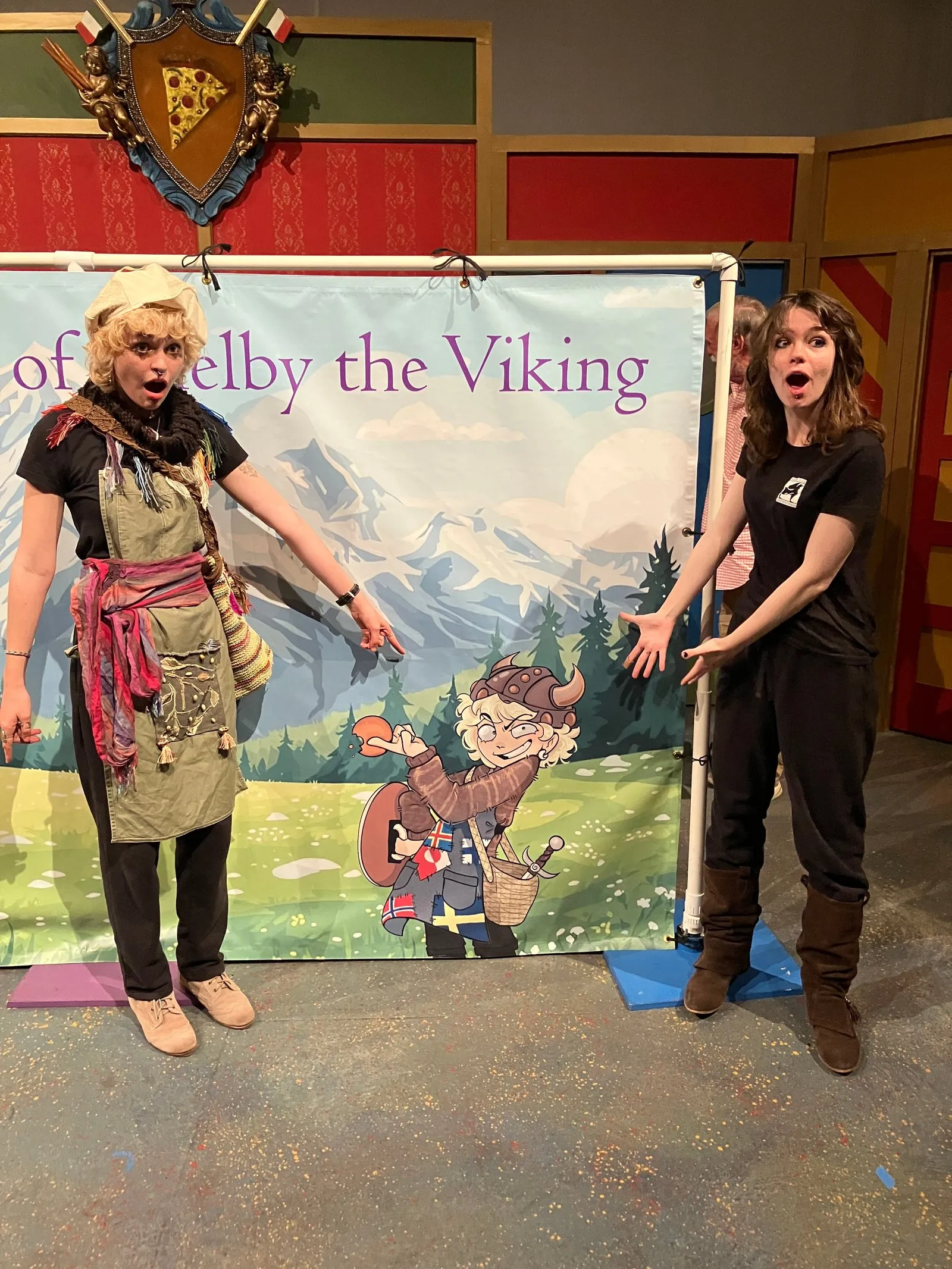 The artist and actor both pointing to Shelby the Viking.