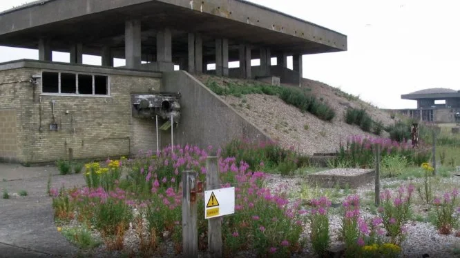 The decay of the untouched military structures, plus a hint of a future topic, Slow-Change (Growth) of nature taking over. Photo from a video essay on decay.