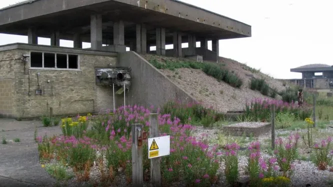 The decay of the untouched military structures, plus a hint of a future topic, Slow-Change (Growth) of nature taking over. Photo from a video essay on decay.