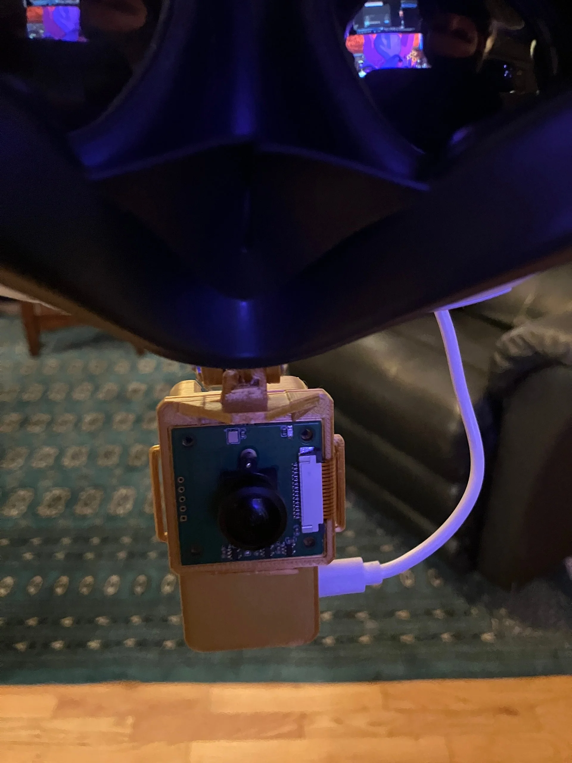 VR headset modded with fisheye camera and microcontrollers.