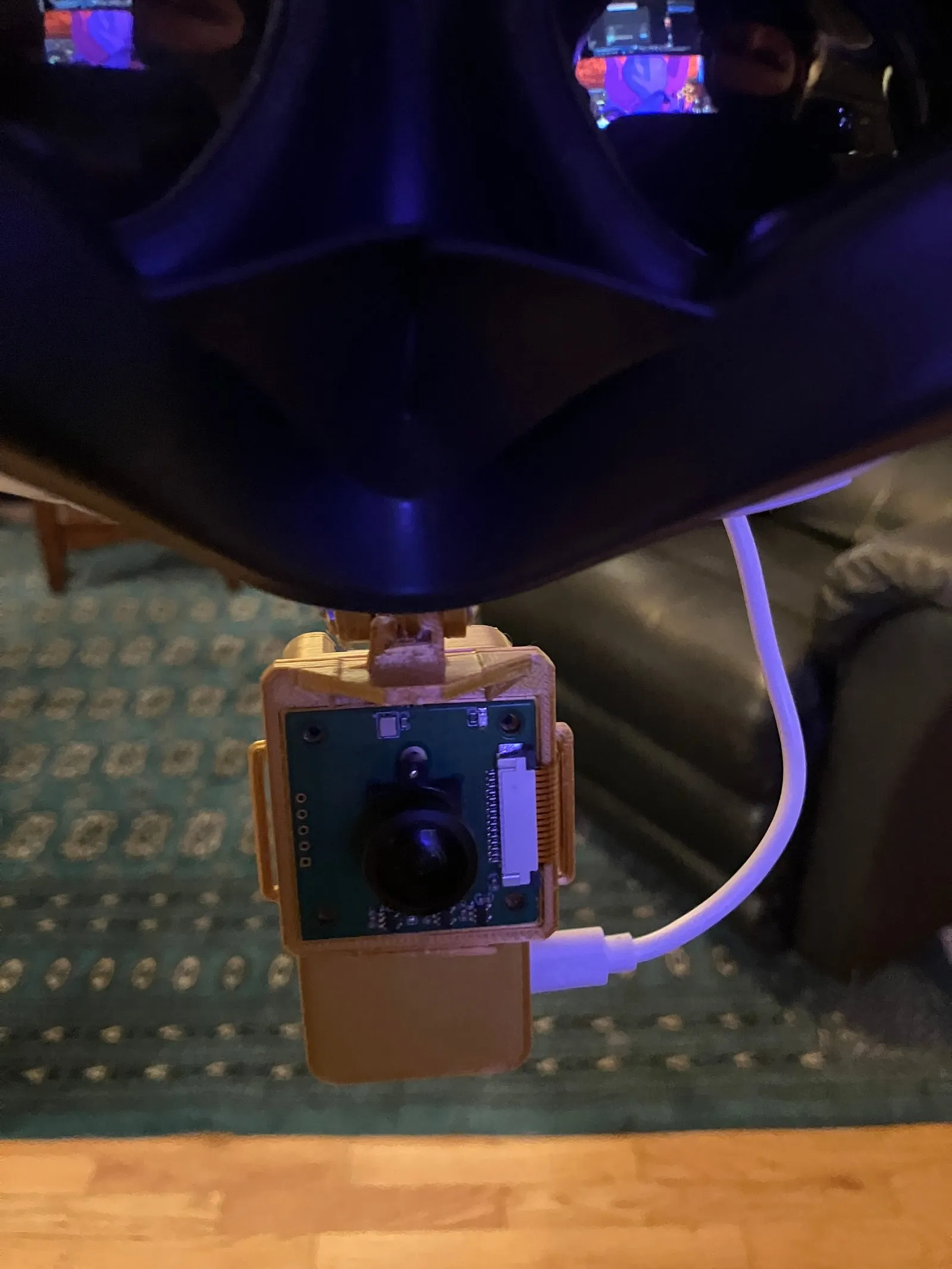 VR headset modded with fisheye camera and microcontrollers.